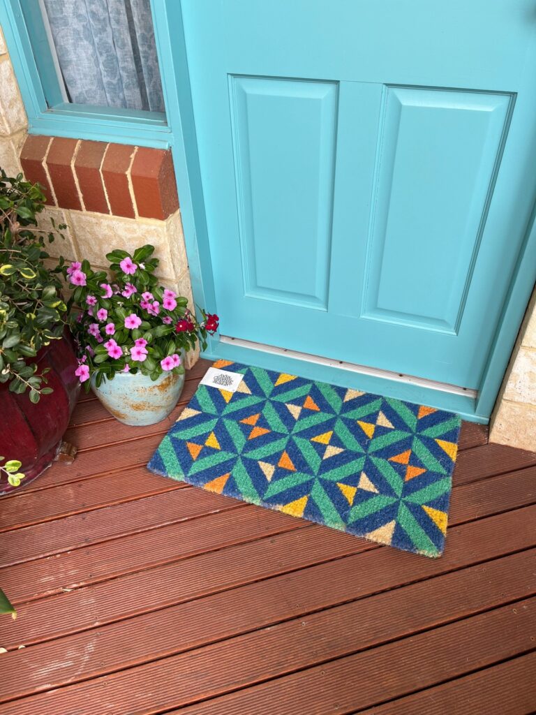 a blue doormat with a blue door