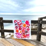 White cotton beach towel with pink and aqua