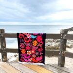 Beach towel black with pink and orange