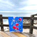 Beach Towel with Cornflower Blue background and peonies and birds